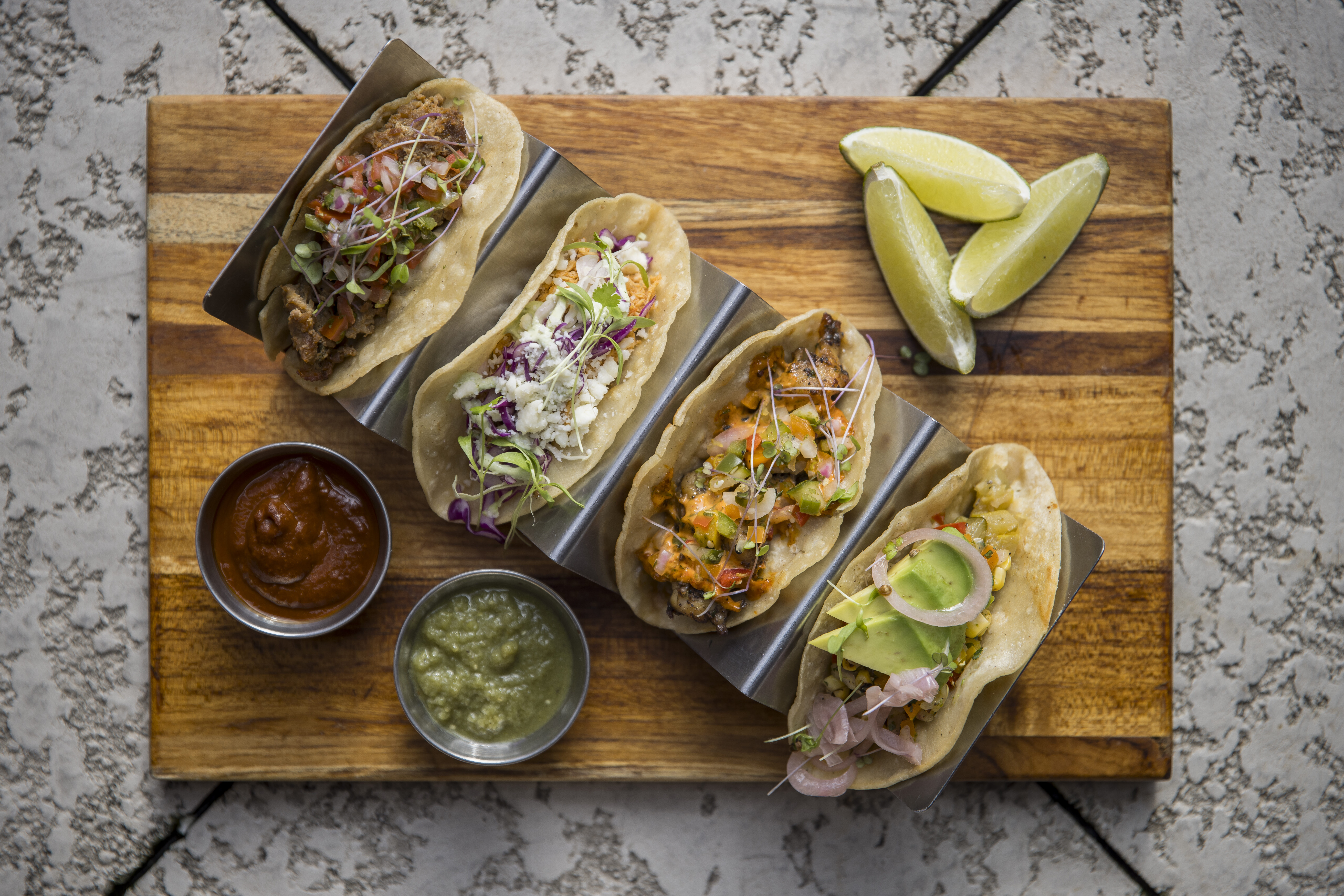 Tacos Plate A restaurant with tables and chairs at Reverence in Midtown Atlanta
